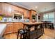View of the kitchen with a dark kitchen island and stainless steel appliances at 109 National Way, Carrollton, GA 30116