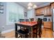 Kitchen with dining area, window with view to the back yard and custom cabinets at 109 National Way, Carrollton, GA 30116