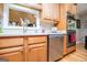 Kitchen featuring stainless steel appliances, wood cabinetry, and open pass-through at 109 National Way, Carrollton, GA 30116