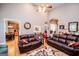 Bright living room featuring hardwood floors, comfortable sofas, a ceiling fan, and an open layout at 109 National Way, Carrollton, GA 30116