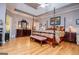 Spacious main bedroom showcasing hardwood floors and decorative lighting at 109 National Way, Carrollton, GA 30116