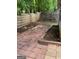 Fenced backyard boasts a brick-paved patio area perfect for outdoor entertaining at 207 Oak N Cir, Stockbridge, GA 30281