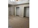 Spacious bedroom features plush carpeting and three closets for ample storage at 207 Oak N Cir, Stockbridge, GA 30281