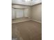 Bright bedroom features large window with cushioned bench and neutral carpeting at 207 Oak N Cir, Stockbridge, GA 30281