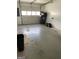 Functional garage space with room for storage and lawn equipment at 207 Oak N Cir, Stockbridge, GA 30281