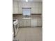 Functional kitchen design featuring white appliances and ample cabinet space at 207 Oak N Cir, Stockbridge, GA 30281