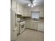 Efficient kitchen featuring essential appliances and ample storage solutions at 207 Oak N Cir, Stockbridge, GA 30281