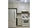 Clean kitchen with efficient white appliances and plenty of storage space at 207 Oak N Cir, Stockbridge, GA 30281