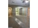 Open-concept living area with fresh paint and views into the bright kitchen at 207 Oak N Cir, Stockbridge, GA 30281