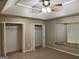 Main bedroom features a tray ceiling, ceiling fan and large closets at 207 Oak N Cir, Stockbridge, GA 30281