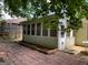 The sunroom addition on the back of the house has many windows at 207 Oak N Cir, Stockbridge, GA 30281
