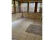 Cozy sunroom features tiled flooring and multiple windows offering natural light at 207 Oak N Cir, Stockbridge, GA 30281