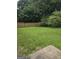 Expansive backyard with lush green grass and a wooden fence, perfect for outdoor activities and privacy at 2985 Garnet Way, South Fulton, GA 30349