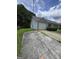 Side view of a charming single-story home with attached garage and driveway at 2985 Garnet Way, South Fulton, GA 30349