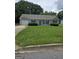 Charming single-story home features a well-manicured lawn, and an attached single car garage at 2985 Garnet Way, South Fulton, GA 30349