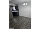 Open kitchen features dark cabinets, stainless steel appliances, and wood-look floors at 2985 Garnet Way, South Fulton, GA 30349