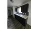 Beautiful kitchen with granite countertops, dark cabinetry, and stainless steel sink at 2985 Garnet Way, South Fulton, GA 30349