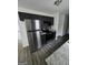Updated kitchen featuring stainless steel appliances, granite countertops, and dark cabinets at 2985 Garnet Way, South Fulton, GA 30349