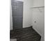 Room with wood-look floors and a wire shelf at 2985 Garnet Way, South Fulton, GA 30349
