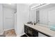Well-lit bathroom with dark vanity and cream countertop at 107 Meadowbrook Ln, Grantville, GA 30220