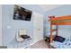 Well-lit bedroom with desk and a bunk bed offering a functional and comfortable space at 107 Meadowbrook Ln, Grantville, GA 30220
