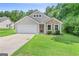 Charming single-Gathering home with a well-manicured lawn and a two-car garage at 107 Meadowbrook Ln, Grantville, GA 30220