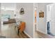 The foyer with an accent chair, hardwood floors, and view of the living room at 107 Meadowbrook Ln, Grantville, GA 30220