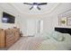 Spacious main bedroom features a trey ceiling, fan, television, decor, ensuite bathroom, and dresser at 107 Meadowbrook Ln, Grantville, GA 30220