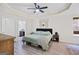 Spacious main bedroom with trey ceiling, ceiling fan, decor, and ensuite bathroom at 107 Meadowbrook Ln, Grantville, GA 30220