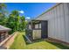 Enclosed dog kennel with metal building in the background at 3700 Tom Brewer Rd, Loganville, GA 30052