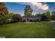 Beautiful home with expansive front lawn, mature trees, and serene setting at 3700 Tom Brewer Rd, Loganville, GA 30052