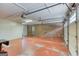 Clean garage features painted brick wall, with plenty of room for storage and accessing the house at 3700 Tom Brewer Rd, Loganville, GA 30052