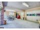 Large garage space perfect for parking, workshop, or recreational activities, with ample lighting and multiple access points at 3700 Tom Brewer Rd, Loganville, GA 30052