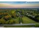 Expansive aerial view of a property with a long driveway, lush greenery, and a serene, wooded landscape at 3700 Tom Brewer Road, Loganville, GA 30052