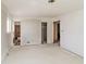 A bedroom featuring white walls, trim, and flooring, and with multiple doorways, and natural light from the windows at 2571 Beech St, Morrow, GA 30260