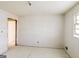 Empty bedroom with white walls and simple window offers a blank canvas for personalization and design at 2571 Beech St, Morrow, GA 30260