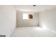 Bright bedroom with white trim, flooring and walls, offering a clean slate for customization and bathed in natural light from window at 2571 Beech St, Morrow, GA 30260