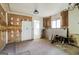 A kitchen showcasing exposed walls, natural light from the windows, and the start of a renovation project at 2571 Beech St, Morrow, GA 30260