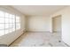 Bright living room featuring large windows for natural light, neutral-toned walls, and flooring, with easy access to other rooms in the house at 2571 Beech St, Morrow, GA 30260