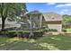 Expansive backyard with lush landscaping, wooden deck, dining area, and swing provides a serene outdoor escape at 139 Ardenlee Dr, Peachtree City, GA 30269