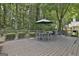 Entertaining wooden deck features an outdoor dining area, seating, and backyard views at 139 Ardenlee Dr, Peachtree City, GA 30269