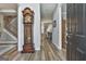 Elegant foyer featuring hardwood floors, a grandfather clock, and a view into the adjacent living room with natural light at 139 Ardenlee Dr, Peachtree City, GA 30269