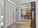 Inviting foyer showcasing hardwood floors, a view into the dining room, and a stylish area rug near the front door at 139 Ardenlee Dr, Peachtree City, GA 30269
