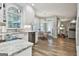 Updated kitchen featuring granite countertops, white cabinets, and stainless steel appliances at 139 Ardenlee Dr, Peachtree City, GA 30269