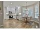 Bright kitchen featuring white cabinetry, stainless steel appliances, and a breakfast nook at 139 Ardenlee Dr, Peachtree City, GA 30269