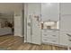 Well-lit kitchen with white cabinets, stainless steel appliances, and a view to the living room at 139 Ardenlee Dr, Peachtree City, GA 30269