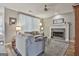 Inviting living room with a fireplace, soft lighting, and hardwood floors at 139 Ardenlee Dr, Peachtree City, GA 30269