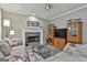 Comfortable living room featuring a fireplace, plush seating, and contemporary decor at 139 Ardenlee Dr, Peachtree City, GA 30269