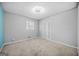 Bedroom features plush carpeting, a gray accent wall, and window for natural light at 2511 Due West Nw Cir, Kennesaw, GA 30152