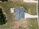 Overhead view showcasing a well-maintained backyard featuring a patio and fire pit on a residential property at 293 Ironwood Dr, Stockbridge, GA 30281